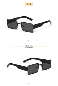 Detail view of rectangular black sunglasses with grey lenses and side temple specs