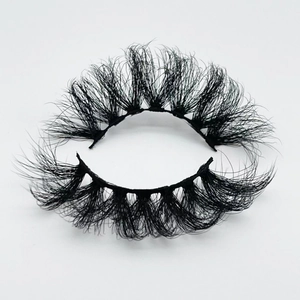 Detailed macro shot of 20mm thick messy faux mink eyelashes with Russian curl effect