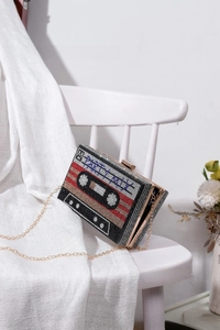 Detail of vintage cassette tape evening bag with rhinestones and PARTY MIX text