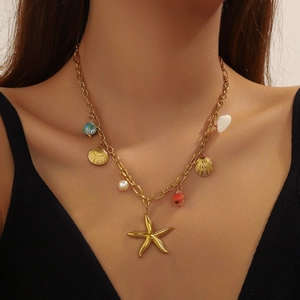 18K gold plated stainless steel necklace with starfish shell charms worn by a model