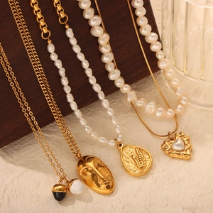 French vintage style heart and abstract face gold necklaces with pearls for women