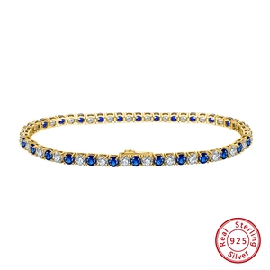 925 silver tennis bracelet with alternating blue and white cubic zirconia stones in gold plating