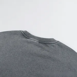 Detail of ribbed crewneck on vintage washed heavy cotton sweatshirt with acid wash finish