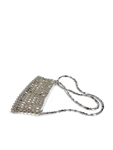 Detail view of silver bead woven purse featuring white zipper and metal chain strap