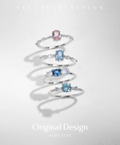 Macro detail of four S925 sterling silver rings with colorful opal and crystal stones