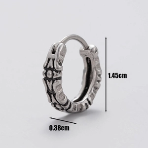 Macro view of vintage silver steel hoop earring showing 1.45cm diameter and cross pattern