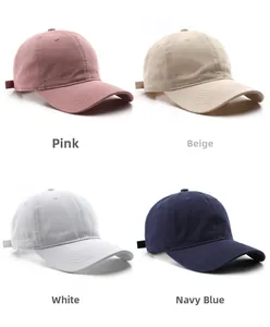 Collection of solid color washed cotton baseball caps in pink, beige, white, and navy blue