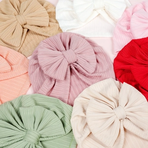 Newborn baby hats with large bows in ribbed elastic fabric, multi-color set display