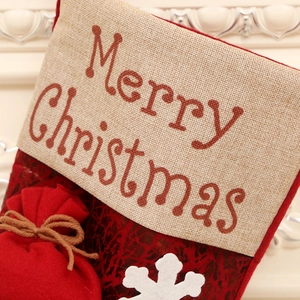 Classic red Christmas stocking with snowflake patterns and Merry Christmas hanging tag
