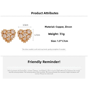 Macro shot of gold-plated heart earring with cubic zirconia and size 1.5x1.7cm