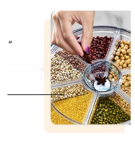 Detailed close-up of rotating grain dispenser with divided sections and insect-proof center