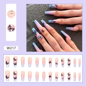 Long coffin press-on nails with purple gradient, marble pattern, blue butterflies and crystals