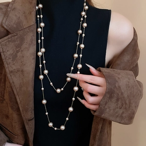 Detail of layered champagne pearl necklace with elegant vintage double strand design