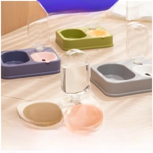 Dual pet food and water bowl with gravity water bottle shown in four colors