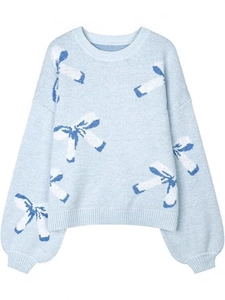 Loose light blue crewneck knit sweater with navy and white bow patterns for women