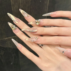 Luxurious champagne cat-eye stiletto press-on nails with 3D crystals and silver wavy lines