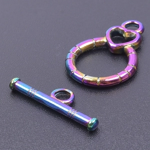 Macro shot of colorful stainless steel OT toggle clasp with heart-shaped ring detail