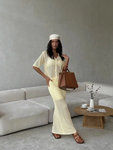 Elegant pale yellow crochet knit set with short sleeve cardigan and long skirt