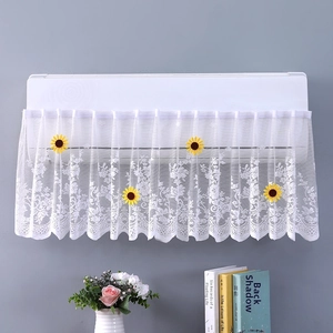 Close-up of white lace air conditioner cover with yellow sunflower details for home decor