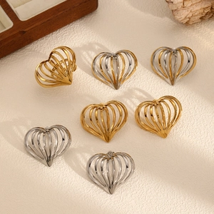 Three-dimensional hollow heart stud earrings in gold and silver finishes for women