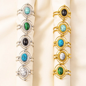 Set of bohemian stainless steel rings with colorful gemstones and beadwork details