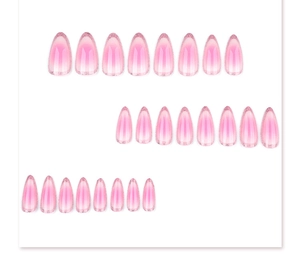 Detailed view of pink gradient almond-shaped press-on nails with subtle glitter edges