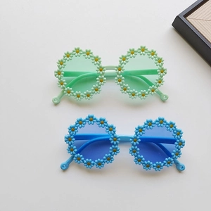 Cute round daisy sunflower shaped kids sunglasses in green and blue for beach styling