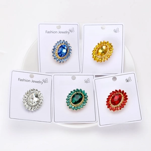 Detailed display of vintage oval crystal sunflower brooches in five vibrant colors