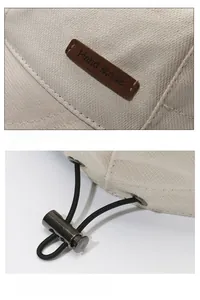 Detail eines beigen Anglerhuts mit handgefertigtem Lederlabel und elastischer Kordelschnalle