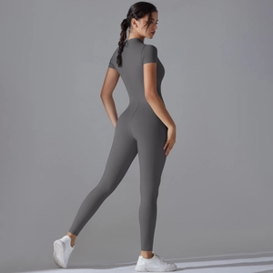 Detail of high-stretch dark grey yoga jumpsuit featuring a high neck and short sleeve design