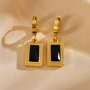 Vintage gold-tone hoop earrings featuring rectangular black zircon with a beaded metal border