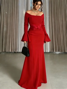 Elegant red off-shoulder evening gown with flare sleeves and floor-length slim fit design