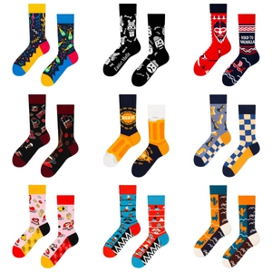 Grid view of asymmetrical crew socks featuring jacquard themes like beer and chess