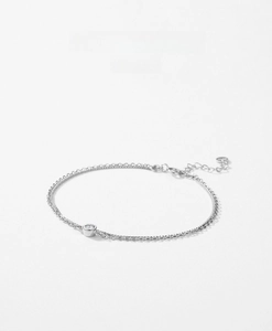 Detail of S925 sterling silver double-layered bracelet with a single round zircon stone