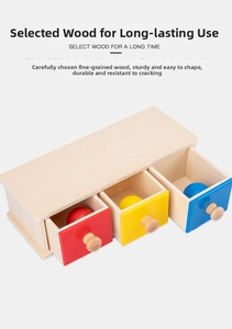 Detail view of Montessori wooden drawer box with three colored balls for early learning