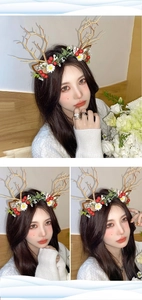 Detail view of brown reindeer antlers headband with red berries and white flowers
