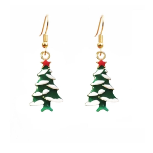 Detail shot of green Christmas tree drop earrings with white snow and red star accents