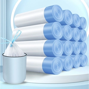 Thickened white drawstring trash bags in rolls with a sample tied in a dustbin