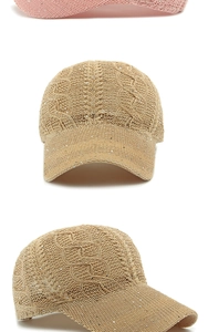 Detail of pink and khaki knitted baseball caps with breathable mesh and shiny sequins