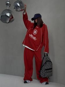 Oversized dark red sportswear set featuring hoodie with stripes and straight-leg trousers