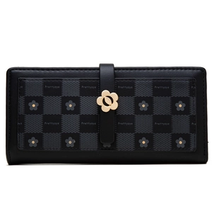 Close-up of black long wallet featuring checkered pattern and gold flower buckle detail