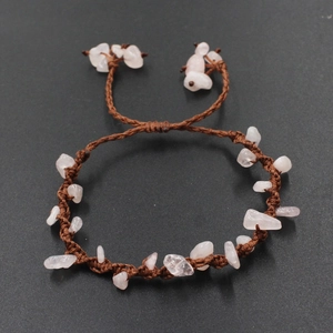 Detailed view of handmade brown woven bracelet featuring natural pink stone chips and adjustable knot