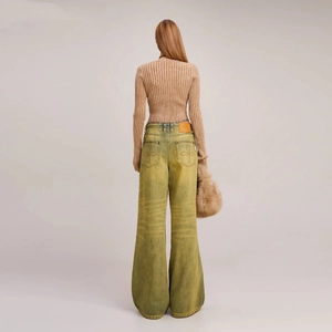 Rear view of vintage ribbed cardigan paired with flared jeans and star embroidery details