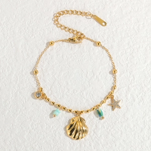French vintage 18k gold stainless steel bracelet with starfish and seashell charms