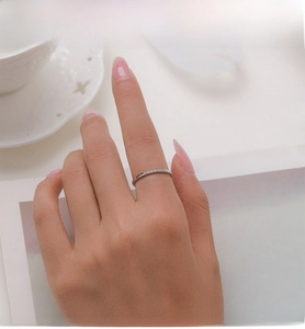 Close-up of S925 sterling silver ring with micro-paved cubic zirconia stones on finger