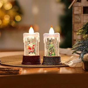 Detail of Christmas lantern with Santa and tree miniature in warm water-filled glow