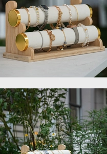 Detailed close-up of a 2-tier bamboo jewelry display stand with soft white velvet bars