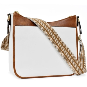 Detail of white and brown bicolor crossbody bag with geometric woven shoulder strap