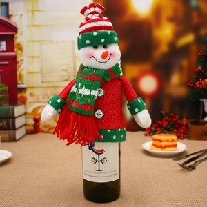Christmas snowman wine bottle cover with red knit sweater and green polka dot hat