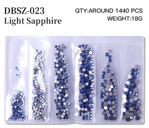 Detail view of light sapphire nail crystals in six sizes for professional DIY manicure art